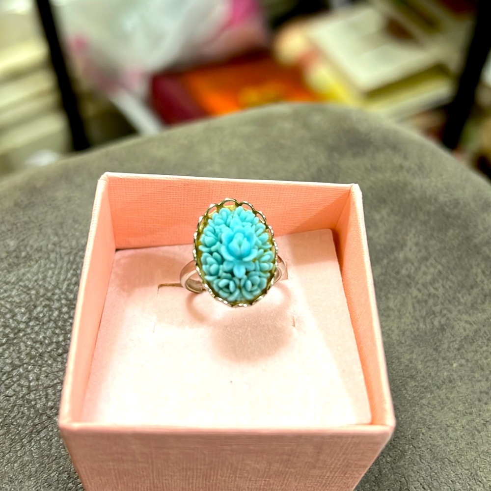 Carved blue ring